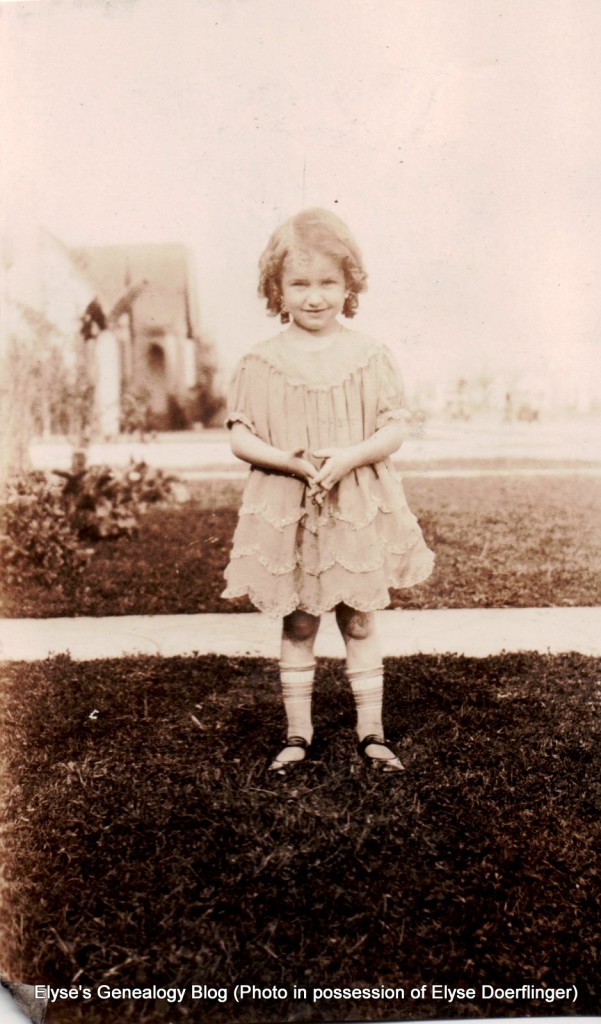 Young Nancy Rogers with curly hair